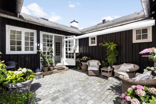 Фасады одноэтажных домов с террасой. В чем преимущества и есть ли недостатки?