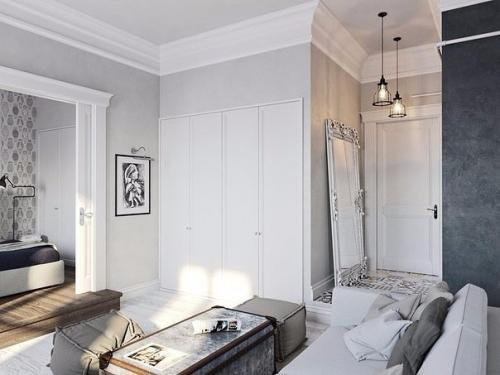 Квартира — студия в белом цвете с кирпичными стены 02