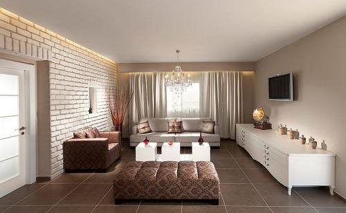 Серые обои и белый кирпич. Преимущества и недостатки