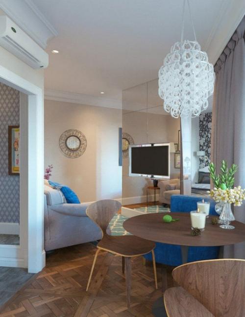 Дизайнеры разместили на 38 квадратах компактную кухню, обеденную зону, гостиную, спальню и санузел.