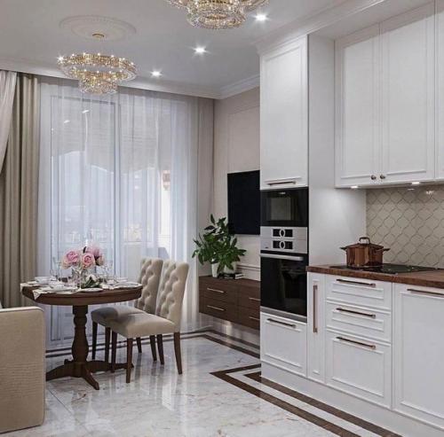 Чудесный дизайн кухни в котором чувствуются классические нотки.