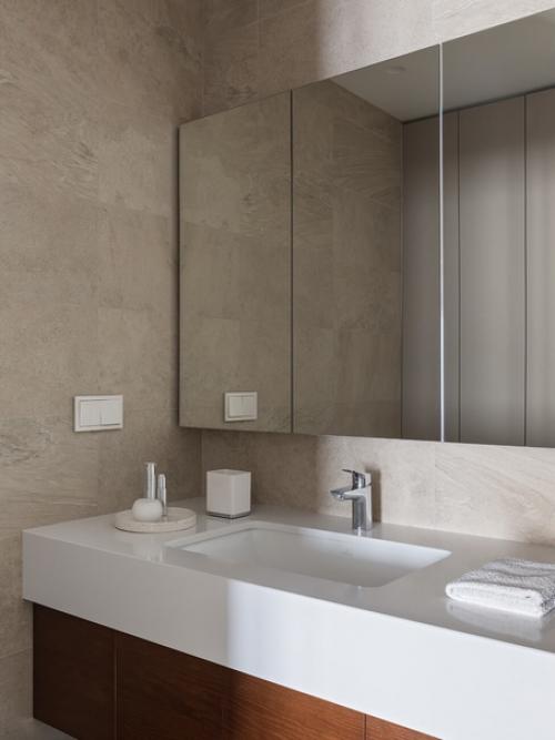 В основе дизайна интерьера - мягкий минимализм: прямые линии, спокойные отделочные материалы и ничего лишнего. 06