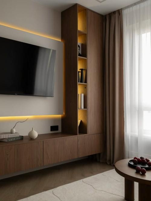 Тёплый интерьер небольшой квартиры с акцентом на тёмное дерево. 03