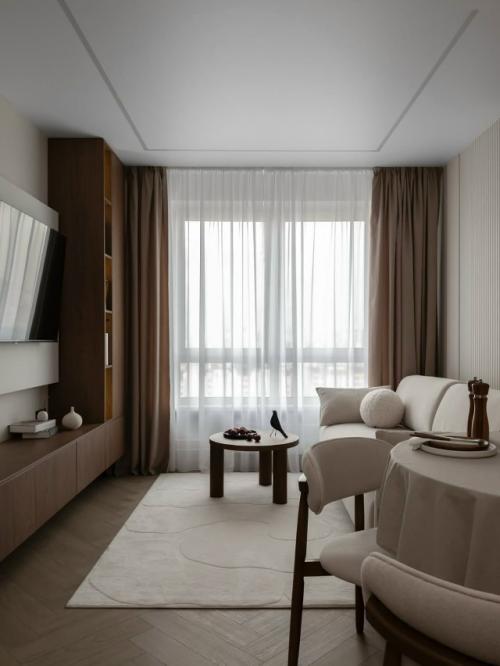 Тёплый интерьер небольшой квартиры с акцентом на тёмное дерево. 02