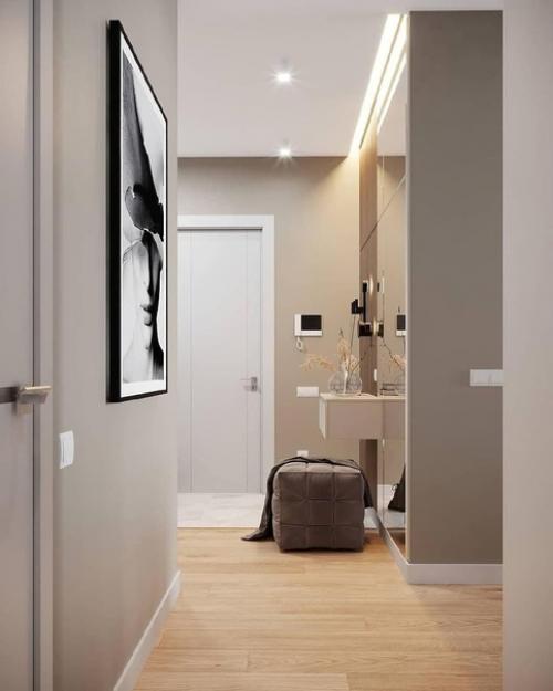 Прихожая с бежевыми обоями или штукатуркой в стиле минимализм будет смотреться стильно, уютно. 02