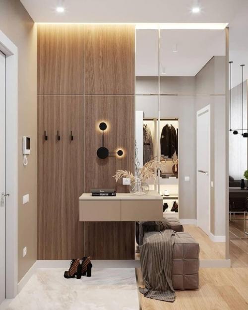 Прихожая с бежевыми обоями или штукатуркой в стиле минимализм будет смотреться стильно, уютно. 01